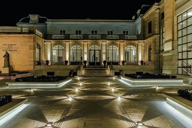 The Moët & Chandon courtyard in Épernay lit at night