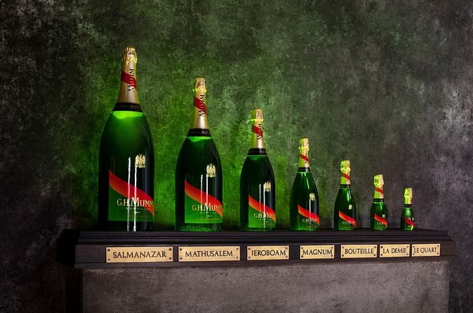 G.H. Mumm bottles in a row from the quarter bottle up to the Salmanazar, each labelled